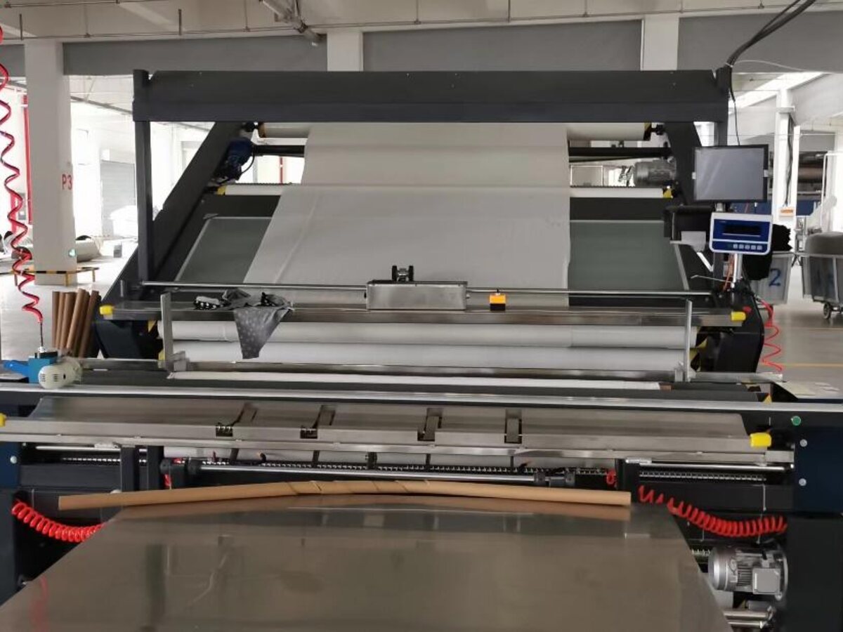 Automatic fabric inspection machine at an overseas supplier facility
